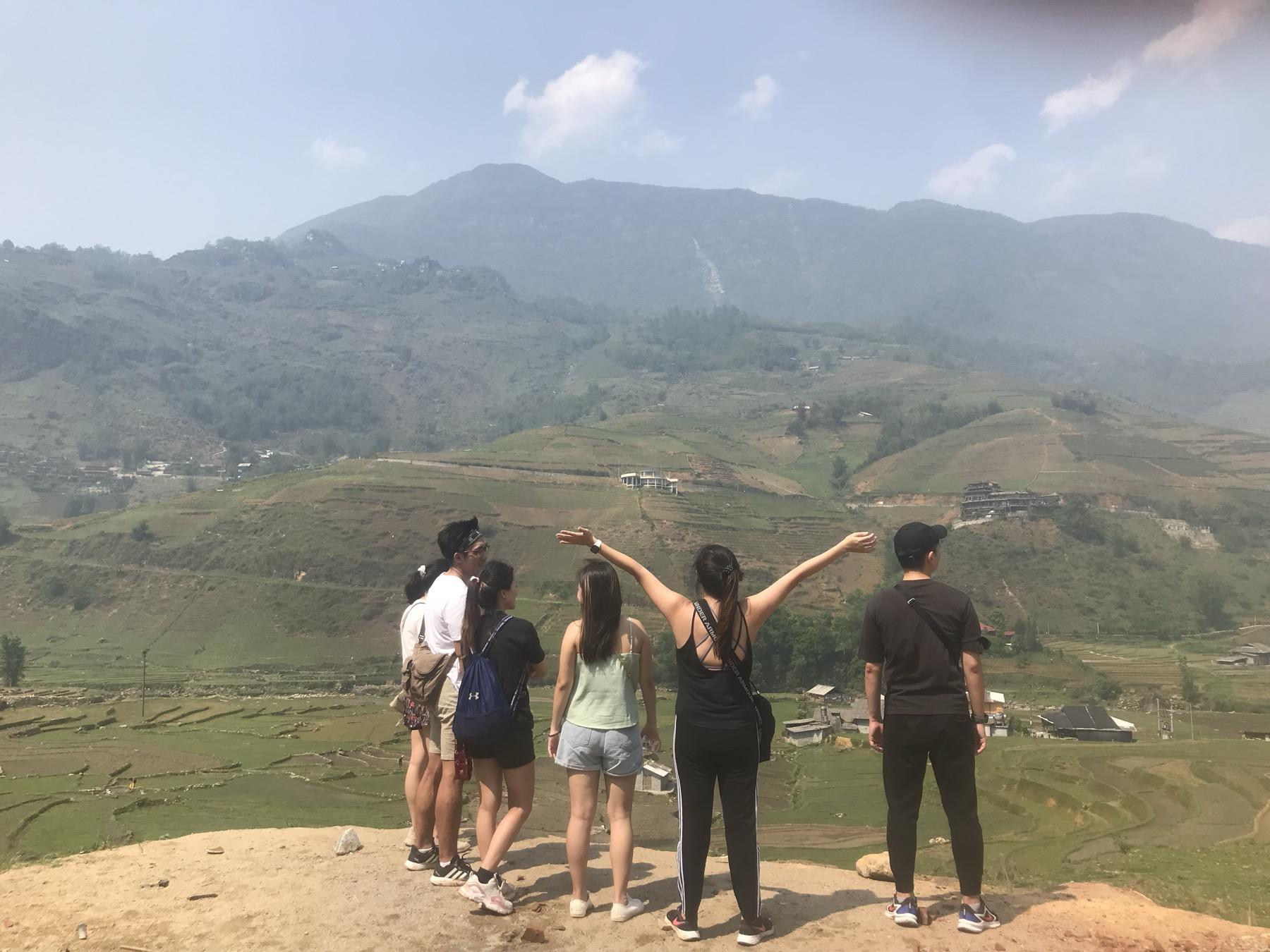 Travelers at a viewpoint over Muong Hoa Valley